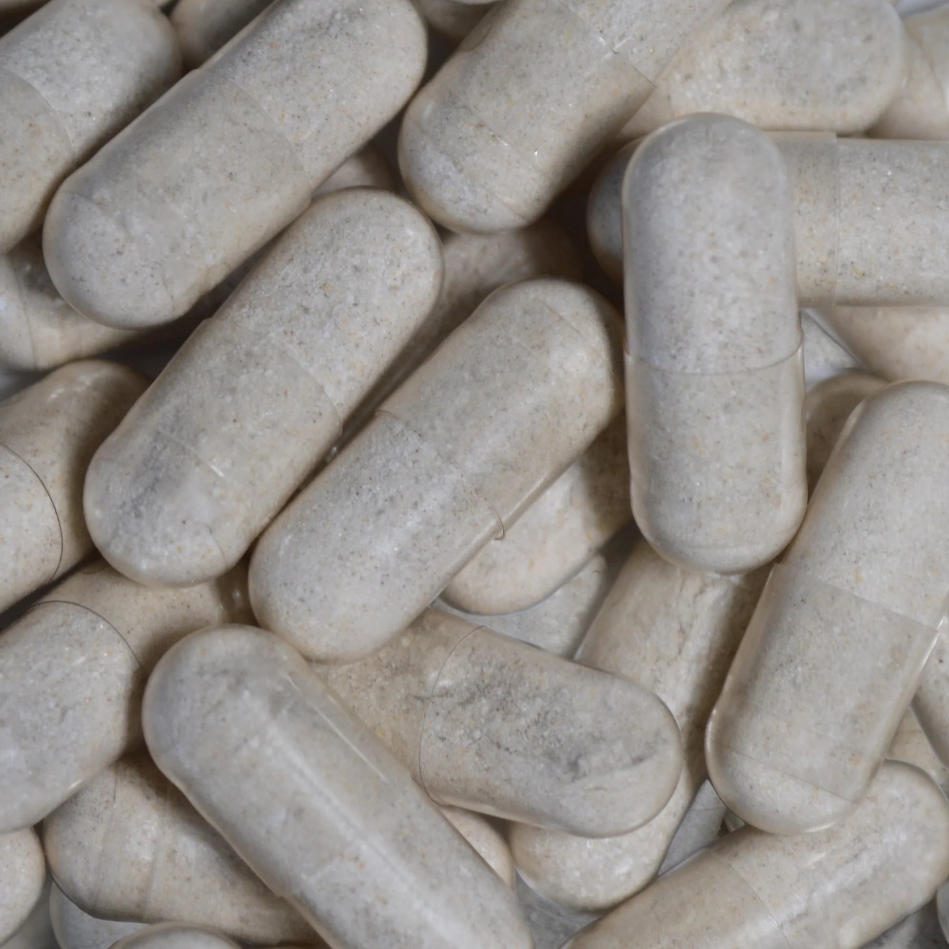Close-up of beige capsules