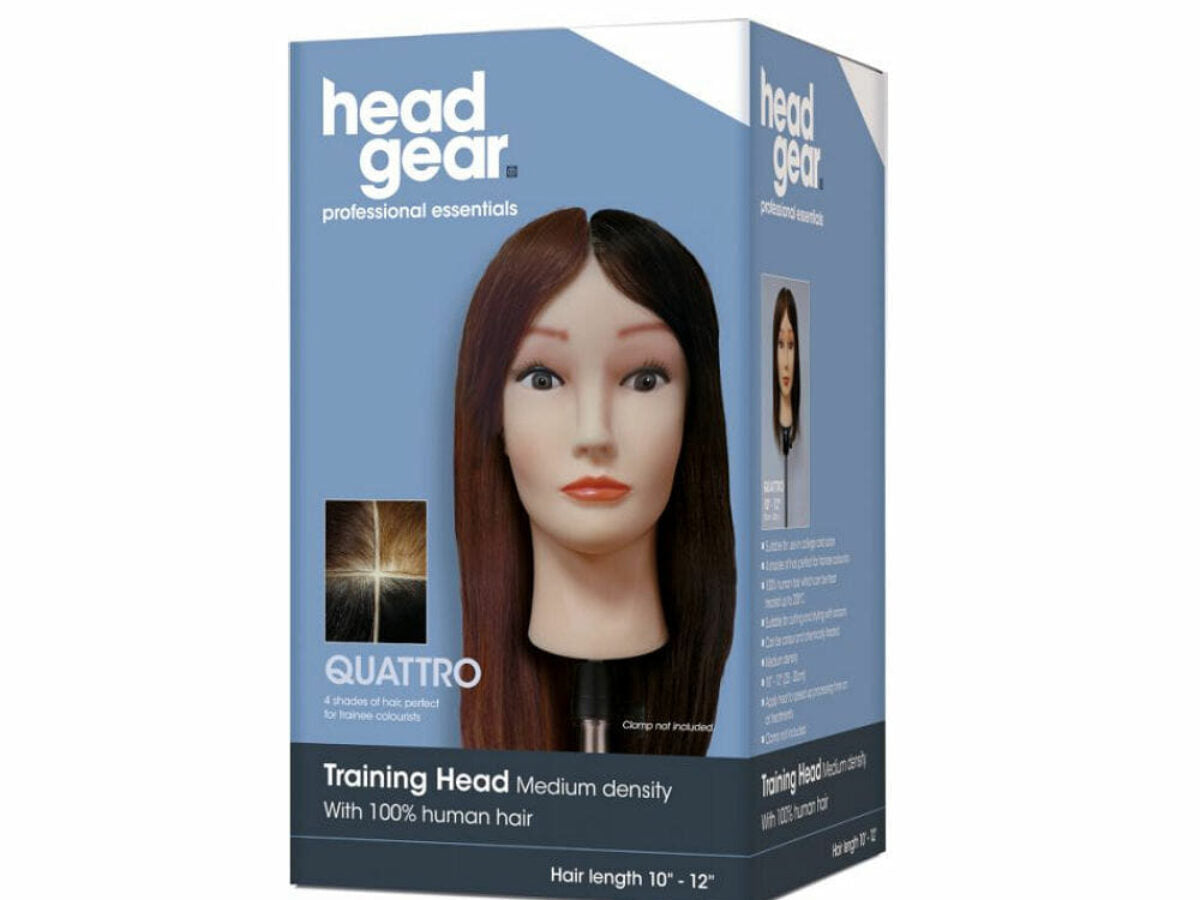 Box of headgear training head with brown hair on a white background