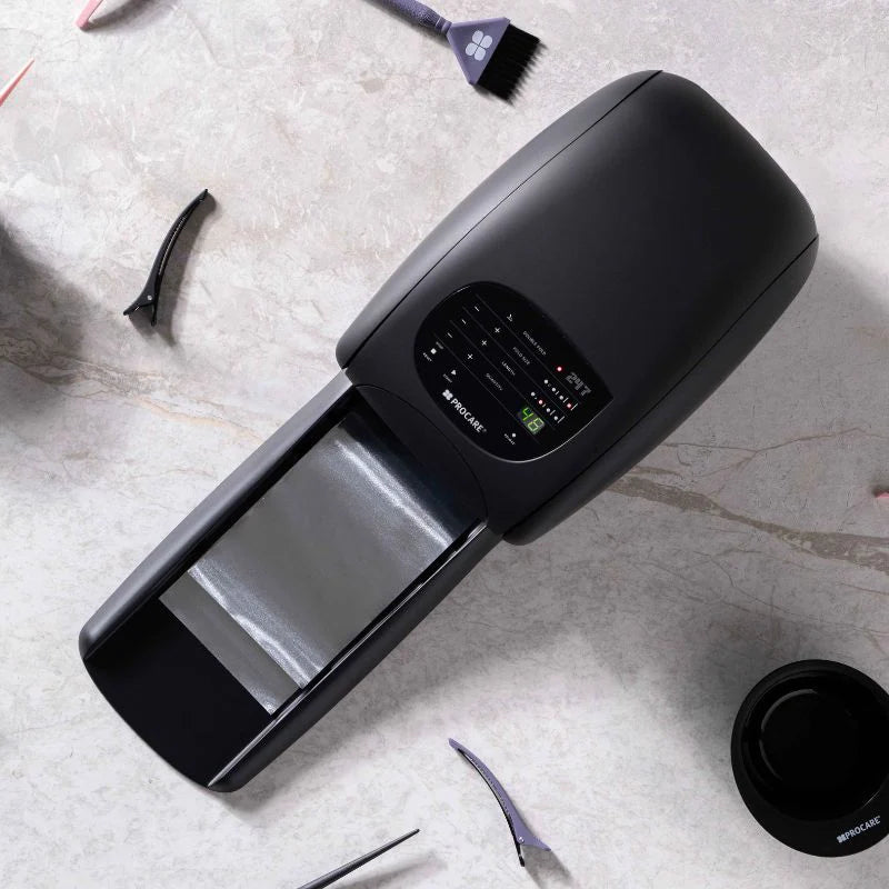 Black electronic device on a textured surface with cleaning tools around